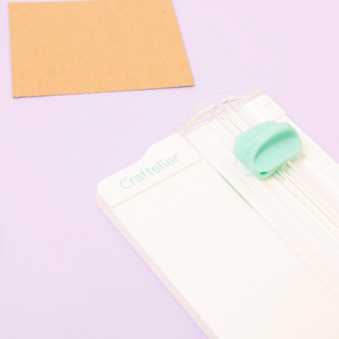 Craftelier - Mini portable cutter to measure and cut paper and cardboard for scrapbooking or crafting with folding tool, blade and transparent ruler | Dimensions 6.5 x 15.3 cm